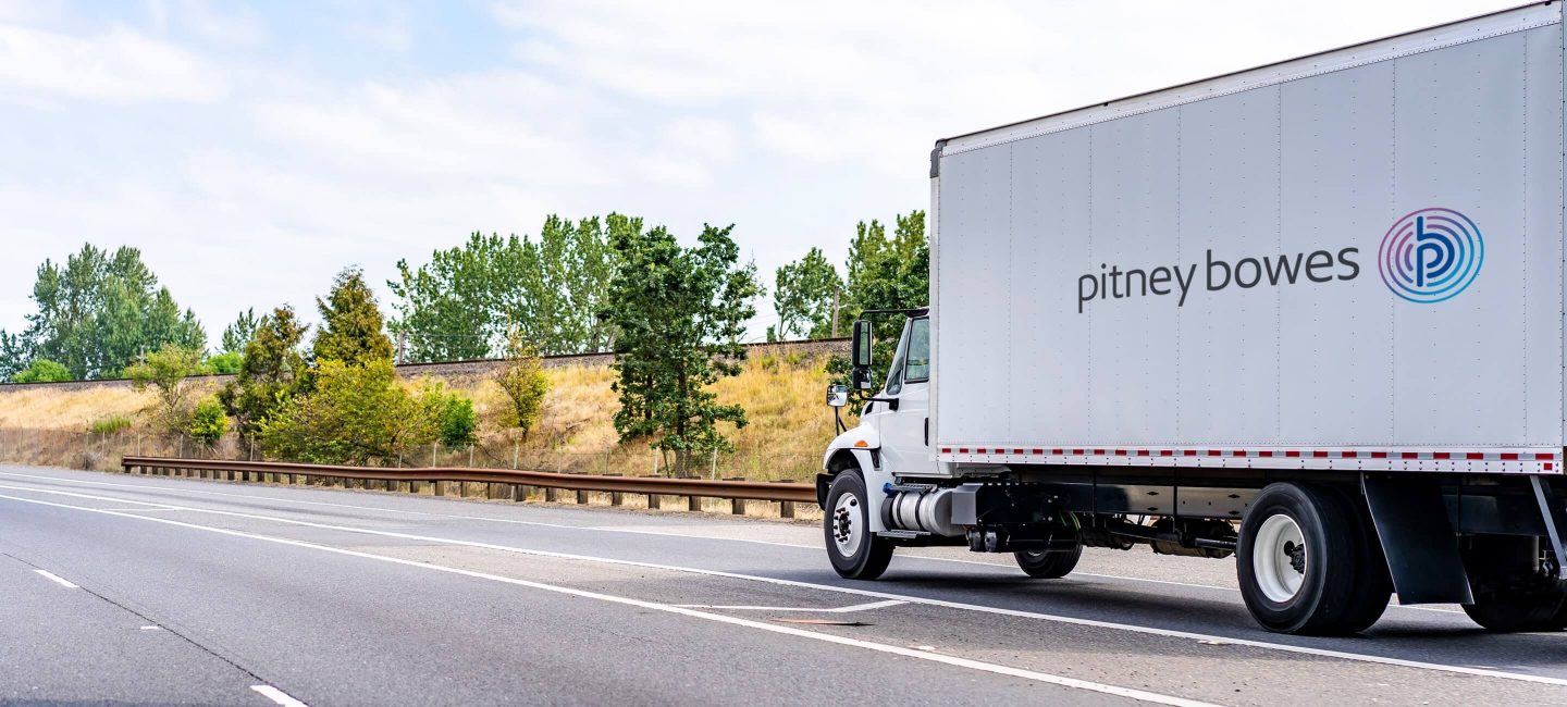 https://www.pitneybowes.com/content/dam/pitneybowes/us/en/shipping-and-mailing/images/GEC-truck-logo-2022_2880x1300.jpg.image.1440.jpg